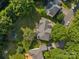 Bird's eye view of a home with a deck, backyard, and driveway in a tree-filled neighborhood at 9038 Sandpiper Dr, Charlotte, NC 28277