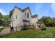 View of backyard featuring a deck, basketball court, privacy fence and lush lawn at 9038 Sandpiper Dr, Charlotte, NC 28277