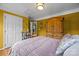 Cozy bedroom features hardwood floors, decorative armoire, and stylish accents at 9038 Sandpiper Dr, Charlotte, NC 28277