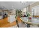 Open-concept dining room with hardwood floors, an open kitchen concept, and ample natural light at 9038 Sandpiper Dr, Charlotte, NC 28277