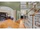 Bright foyer with hardwood floors and a staircase leading to the second floor at 9038 Sandpiper Dr, Charlotte, NC 28277