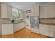 Charming kitchen featuring custom cabinets, granite countertops, stainless steel appliances, and hardwood floors at 9038 Sandpiper Dr, Charlotte, NC 28277