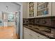 Elegant kitchen featuring custom cabinets, marble countertops, and stainless-steel appliances at 9038 Sandpiper Dr, Charlotte, NC 28277