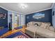 Inviting living room with sectional sofa, hardwood floors, and sports-themed decor for relaxation and entertainment at 9038 Sandpiper Dr, Charlotte, NC 28277
