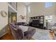 Spacious living room with hardwood floors, two-story ceilings, and a large sectional couch at 9038 Sandpiper Dr, Charlotte, NC 28277