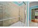 Tiled shower features a glass door, providing a clean and modern look to the bathroom space at 9038 Sandpiper Dr, Charlotte, NC 28277