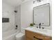 Bright bathroom featuring black hardware, marble-look tile and decorative niche at 922 Maurice St, Monroe, NC 28112
