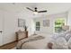 Bright bedroom featuring neutral tones, natural light from two windows, and modern furnishings at 922 Maurice St, Monroe, NC 28112