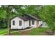 Charming home with fresh exterior paint, black trim, and a well-maintained front yard at 922 Maurice St, Monroe, NC 28112
