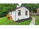 Side view of a charming home with fresh exterior paint, black trim, and a wooden deck at 922 Maurice St, Monroe, NC 28112
