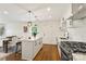 Charming kitchen features a center island, stainless steel appliances, and open concept floor plan at 922 Maurice St, Monroe, NC 28112