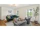 Bright living room with hardwood floors, ample natural light, and stylish furniture at 922 Maurice St, Monroe, NC 28112