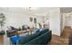Open-concept living room with hardwood floors, modern lighting, and stylish decor at 922 Maurice St, Monroe, NC 28112