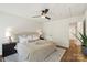 Bright bedroom features neutral colors, a ceiling fan, and an ensuite bathroom, creating a serene retreat at 922 Maurice St, Monroe, NC 28112