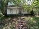Exterior of an older home with covered porch needing some TLC at 0 Woodleaf Rd, Salisbury, NC 28147