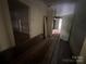 Hallway with views of additional rooms, showing signs of needed repair at 0 Woodleaf Rd, Salisbury, NC 28147