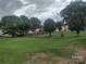 Large backyard featuring a spacious grassy area with mature trees providing shade at 1017 W C St, Kannapolis, NC 28081