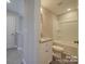 A modern bathroom with a vanity, a tub and shower combo, and a neutral color palette at 1017 W C St, Kannapolis, NC 28081