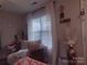 Cozy bedroom retreat featuring soft textures, natural light, and a tranquil ambiance at 1017 W C St, Kannapolis, NC 28081