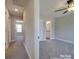 A serene bedroom with neutral carpet, a ceiling fan, and an ensuite bathroom at 1017 W C St, Kannapolis, NC 28081