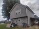 Side view of the home showing the well-maintained exterior and spacious backyard at 1017 W C St, Kannapolis, NC 28081