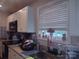 Bright kitchen with granite counters, modern appliances, and ample natural light from the window at 1017 W C St, Kannapolis, NC 28081