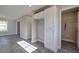 Bright room featuring gray plank flooring, white trim, doors and cabinets at 1017 W C St, Kannapolis, NC 28081