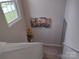 Bright staircase with neutral paint and carpet, leading to the upper level of the home at 1017 W C St, Kannapolis, NC 28081