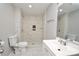 Updated bathroom featuring a walk-in shower with designer tile and modern fixtures, plus a pedestal sink at 1020 N Ransom St, Gastonia, NC 28052