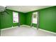 Cozy bedroom featuring base molding, a window and neutral flooring at 1020 N Ransom St, Gastonia, NC 28052