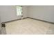 Bright bedroom featuring tile floors, fresh paint, and a sunny window at 1020 N Ransom St, Gastonia, NC 28052