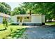 Charming one-story home featuring a welcoming front porch and well-maintained lawn, with a stone path leading to the entrance at 1020 N Ransom St, Gastonia, NC 28052