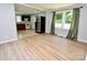 Open-concept kitchen with stainless fridge, window and tile flooring at 1020 N Ransom St, Gastonia, NC 28052