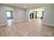 Bright living area with resilient floors, connecting seamlessly to the kitchen at 1020 N Ransom St, Gastonia, NC 28052