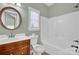 Bathroom features a dark wood vanity, white fixtures, and neutral paint at 116 Postell Dr, Statesville, NC 28625
