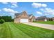 Attractive brick home with a long driveway and well-maintained landscaping at 116 Postell Dr, Statesville, NC 28625