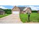 Charming brick home with a large driveway and manicured lawn at 116 Postell Dr, Statesville, NC 28625