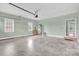 Spacious garage with concrete flooring, two windows, and neutral colored walls at 116 Postell Dr, Statesville, NC 28625