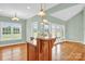 Eat-in kitchen featuring a breakfast bar, stainless steel appliances, and natural light at 116 Postell Dr, Statesville, NC 28625