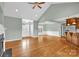 Spacious living room with hardwood floors that flows into the kitchen at 116 Postell Dr, Statesville, NC 28625