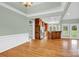 Open living space featuring hardwood floors and seamless flow into the modern kitchen at 116 Postell Dr, Statesville, NC 28625