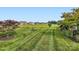Expansive grassy backyard with views of neighborhood homes and trees at 125 Rosebay Dr, Mooresville, NC 28117