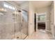 Modern bathroom with a glass-enclosed shower and views into the primary bedroom at 125 Rosebay Dr, Mooresville, NC 28117
