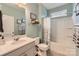 Well-lit bathroom featuring a shower-tub combo and modern sink at 125 Rosebay Dr, Mooresville, NC 28117