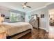 Well-lit bedroom with hardwood floors, and neutral-colored walls at 125 Rosebay Dr, Mooresville, NC 28117