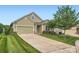Charming home with a well-manicured lawn, attached garage, and inviting curb appeal in a Gathering-friendly neighborhood at 125 Rosebay Dr, Mooresville, NC 28117