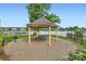 Scenic gazebo overlooking the tranquil lake; an idyllic spot for relaxation and gatherings at 125 Rosebay Dr, Mooresville, NC 28117