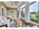 Relaxing screened patio with comfortable seating and views of the backyard at 125 Rosebay Dr, Mooresville, NC 28117