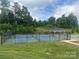 Community pickleball courts surrounded by lush greenery, offering a fun and active recreational space at 125 Rosebay Dr, Mooresville, NC 28117