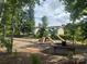 Community playground with swings, slides, and climbing structures, providing a safe and fun area for children at 125 Rosebay Dr, Mooresville, NC 28117